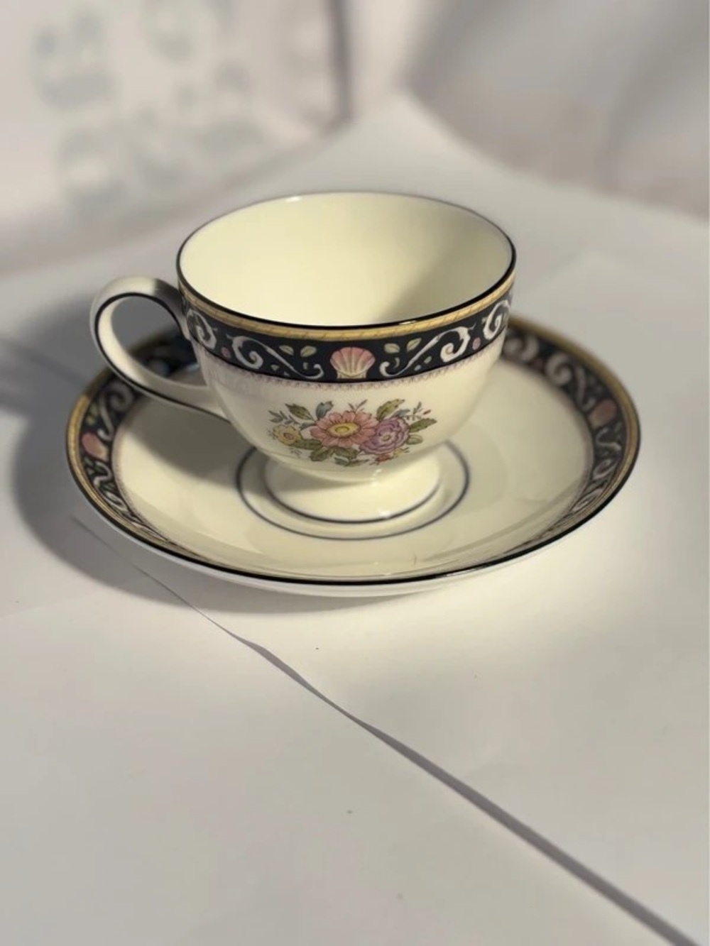 Cream Floral Accent Teacup and Saucer with Gold Trim